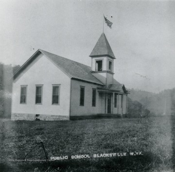 Transcribed on back "White building, Blacksville Grade School. Later Gyme, Voag room, shop, torn down".