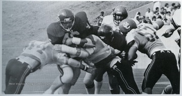 Easley played for West Virginia University during the 1976-1980 seasons. He scored the first touchdown at the new Mountaineer field against Cincinnati in this September 6, 1980 game.