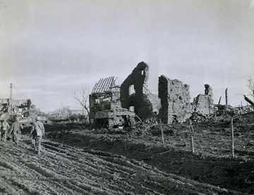 Tanks and soldiers traveled past destroyed buildings as they push through Germany in the spring of 1945. 