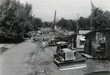 Built in the wake of the devastating Flood of 1937, when the Ohio River crested at more than 19 feet above flood stage at Huntington. The flood wall built in 3 separate sections. Shown here is the Guyandotte section under construction.