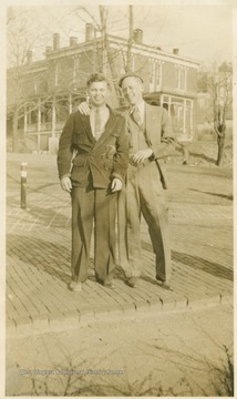 The Experiment Station building is seen in the background. Bond subsequently became a Professor of Journalism at WVU.