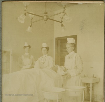 Nurses at the Miners' Memorial Hospital prep a patient for a medical procedure.