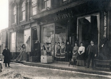 Workers stand out front of what appears to be a home goods store.