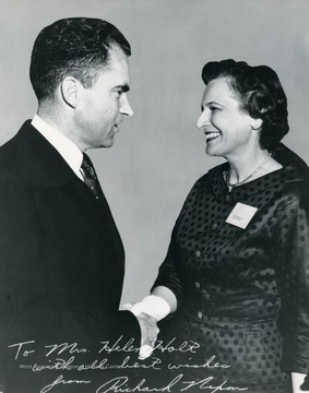 Helen Holt served as the first woman Secretary of State of West Virginia. She also led the most important program in housing and health care for the elderly through her work with the Federal Housing Administration. She established nationally high standards of care and oversaw the construction of 1,000 health care facilities. The photograph was most likely taken when Richard Nixon was Vice President of the United States.