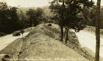 Car going around 330 degree turn on Laurel Mountain. See original for correspondence. (From postcard collection legacy system.)