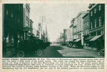 Caption on postcard reads: "This view of Martinsburg's main business artery looks north and was taken a little north of the public square. The street was named for Queen Charlotte, wife of George III, King of England at the time Martinsburg was laid out in 1773. At the public square Queen Street intersects King Street. The town as originally surveyed comprised 130 acres, divided into 279 lots. This land was owned by General Adam Stephen, founder of the town. When the Revolution began in 1775 Martinsburg had but 150 inhabitants, one percent of the present population approximately 15,000." Published by Shenandoah Publishing House. (From postcard collection legacy system.)