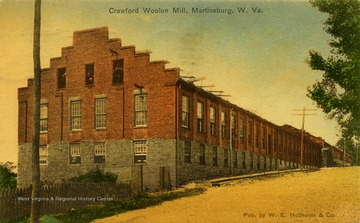 In 1891 W.H. Crawford established the Crawford Woolen Company which employed fifteen workers and produced around seven hundred yards of cloth a week. In less than fifteen years Crawford's textile plant failed due to the old age of the operating machines and low capital. During the same time a number of modern electric powered mills moved to Martinsburg, turning it into an important textile center. Published by W.E. Holfheins &amp; Company. (From postcard collection legacy system.)