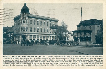 Caption on postcard reads: "When Martinsburg was laid out at the outset of the Revolution, provision was made for a public square at the intersection of King and Queen streets by taking a quarter of each of the four contiguous blocks. Down through the years the public square has played an important role in the life of first the village, then the town, and now the city. Above is shown Comrey's Concert Band giving a concert prior to the annual Berkeley County Fair parade. The large building in the picture is the home of the Old National Bank, the oldest banking institution in the city, organized in 1865. See original for correspondence. Published by Shenandoah Publishing House. (From postcard collection legacy system.)