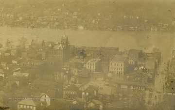 Ohio River flooding into the city of Wellsburg, West Virginia. See original for correspondence. (From postcard collection legacy system.)