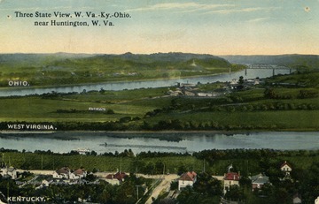 From this view you can see parts of three different states, Ohio, West Virginia, and Kentucky. You can also see The Big Sandy River where there is a white boat traveling. The Big Sandy River is a tributary of the Ohio River and is the border between West Virginia and Kentucky. See original for correspondence. (From postcard collection legacy system.)