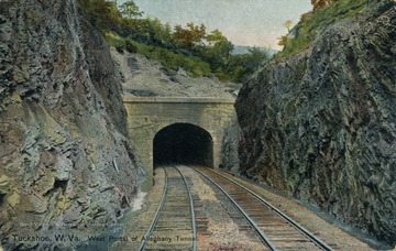 Train tracks running through rocky mountain sides into a tunnel. Published by the Hugh C. Leighton Company. See original for correspondence. (From postcard collection legacy system.)