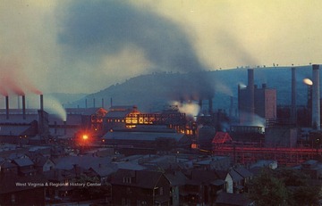 Caption on back of postcard reads: "Steel Mills belching forth smoke and the brilliant glow of molten iron are a familiar sight in the Ohio River Valley. From Weirton and Wheeling in the Pittsburgh area south to Ashland, Ky. and other river cities". Published by Dexter Press Incorporated. (From postcard collection legacy system.)