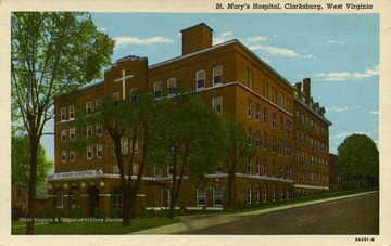 Caption on back of postcard reads: "St. Mary's Hospital, the former Harrison County Hospital, established by progressive physicians and taken over by the Sisters of St. Joseph, has been enlarged by the addition of several units. It has been recognized as first class by the American College of Surgeons since the organization of the College in 1905. It is equipped with the most modern X-Ray, Deep Therapy, Physio-Therapy, Fever Machines available and an up to date clinical laboratory with full time pathologist". Published by Rex Heck News Company. (From postcard collection legacy system.)
