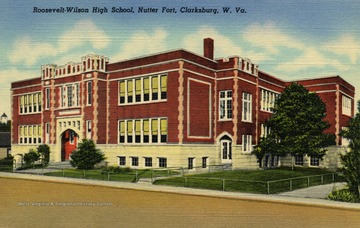 Caption on back of postcard reads: "This High School is erected on the site of Nutter's Fort, founded by Thomas Nutter in 1772. Nutter was a captain during the Revolutionary War. The fort was used by refugees fleeing the Indian raids in 1779". Published by Rex Heck News Company. (From postcard collection legacy system.)