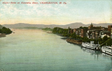 Several ferry boats docked along the side of the Kanawha River. See original for correspondence. (From postcard collection legacy system.)