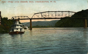 Horse and buggies travel across the bridge while several ferries and a canoer travel underneath. (From postcard collection legacy system.)