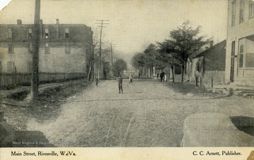 Children play in middle of Main Street in Rivesville, West Virginia. Published by C.C. Arnett. (From postcard collection legacy system.)