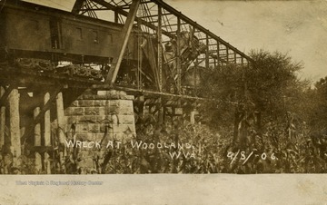 Train pile up on bridge. (From postcard collection legacy system.)