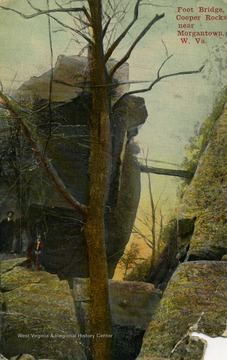 Two people stand under the towering rock on the left. Published by Sheble and Maxwell. (From postcard collection legacy system.)