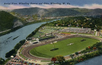 Race track and horse stables can be seen in the foreground. Published by L.C. Knee of Photo Crafters. (From postcard collection legacy system.)