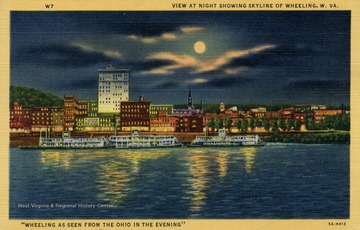 Wheeling as seen from the Ohio River in the evening. Steamboats docked for the night along the river's edge outside of a lit up cityscape. Caption on back of postcard reads: "Boats started to carry mail from Wheeling to Cincinnati, Ohio on the Ohio River about 1795. Wheeling's population in the year 1800 was about 500. The present population is near 70,000." Published by Arco Agency. (From postcard collection legacy system.)