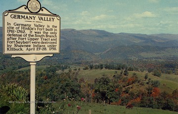 Sign on postcard reads: "In Germany Valley is the site of Hinkle's Fort built in 1761-1762. It was the only defense of the South Branch after Fort Upper Tract and Fort Seybert were destroyed by Shawnee Indians under Killbuck, April 27-28, 1758." Published by Valley News Agency. (From postcard collection legacy system.)