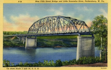 On State Route 2 and 14, U.S. 21. Caption on back of postcard reads: "The Fifth Street Bridge cost approximately $515,000 and was opened to traffic on May 7, 1937. View from Parkersburg side to South Side of City. Published by Genuine Curteich. (From postcard collection legacy system--subject.)
