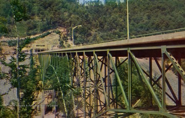 Bridge is 284 feet high, the highest bridge east of the Mississippi River. Published by Mike Roberts Color Production. (From postcard collection legacy system--subject.)