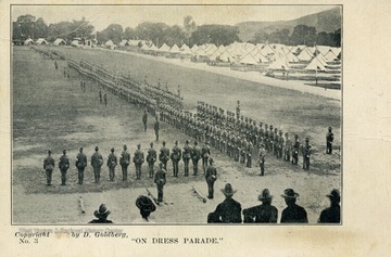 West Virginia National Guard members standing in formation in field outside of encampment. (From postcard collection legacy system--subject.)