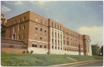 Postcard reads, "Symbol of the University's expansion is Brooks Hall, one of the newest buildings on campus, and home of Biology and Plant Pathology Departments. Natural History Museum, 1000,000-specimen Herbarium are located here. Also has many laboratories, research facilities." Brooks Hall is currently home of the Geology and Geography Departments. (From postcard collection legacy system--subject.)