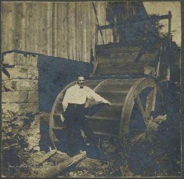 Unidentified poses outside a mill near Morgantown.