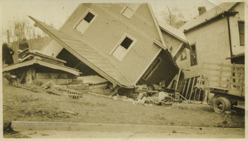 Photo showing the Dock Poe House on 8th and McLean Streets after the tornado. 