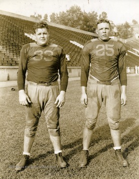 Fred Buskier on left and "Moose" Hodges on right. West Virginia University football players. Print number 202b.