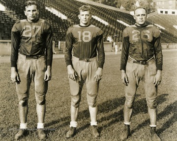 From left to right: Nebera, Carder, Ingraham. West Virginia University football players. Print number 202h.