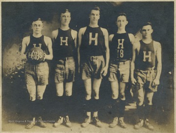 Team portrait of the high school's basketball team. Subjects unidentified.