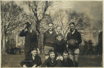 Unidentified persons gather to play a game of basketball.