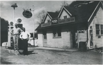 From left to right: Zina, Earl and son Bernard B. Angell pose in front of the station located at the mouth of Beech Run.