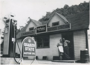 Selling Keystone Gas, Earl &amp; Minnie Angell pose in front of the store located at the mouth of Beech Run.