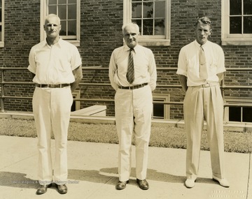 Print number 387. From left to right: Smith, Bierman, and Glenn.