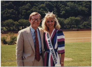 President Gordon Gee of West Virginia University poses with Melanne Pennington, aka Miss West Virginia.