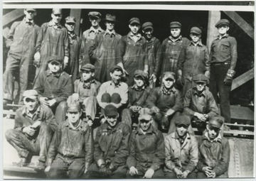 Photo of Machinists, electricians, carman, etc. Front row, left to right: Jack Wicker; "Dec" Meadows; Jim Lindsay; Lynn W. McMann; Ted Haythe; Charley Young. Middle row, left to right: Hershel Gilpin; Raymond Thornton; Bill Lovelace; Bob Terry; Norvel "Dink" Reid; Charlie Norris. Back row, left to right: Ferrell Harford; Ike Bowman; Merritt Reid; Moody Burdette; EK "Toots" Rogers; Merridith Nicely; Chris Baer; WA "Fatty" Arrington; "Blu Jay" Nicely; JD "Dizzy Turner. 