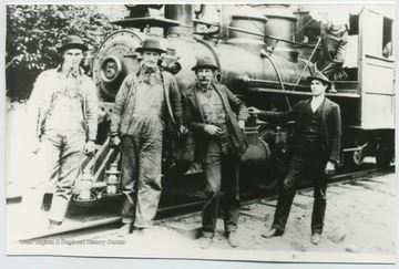 Second man from the left is Hayes Foster. The rest are unidentified. 