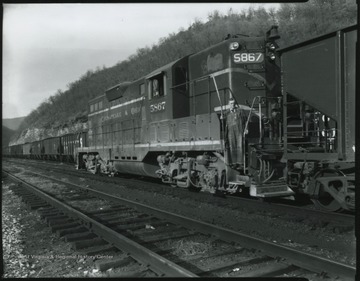 A train occupies the tracks of the yard near Hinton, W. Va.