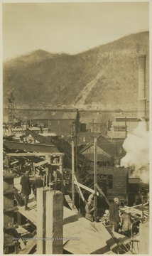 Workers on the site overlooking the town.