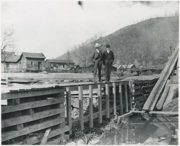 R.O. Murrell &amp; James pictured with the Pleasant Street bridge in the background.