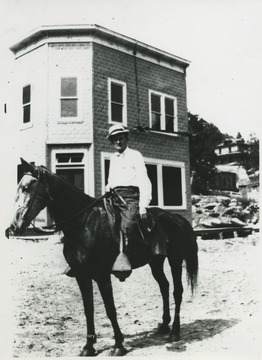 Chafin pictured on a horse outside a building.