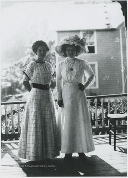 Nina, pictured on the left, and Mary pose on the porch of the Cook home.