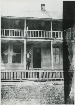 Dr. Early poses in front of his building.