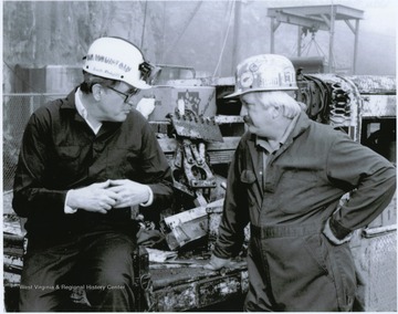 Rockefeller, pictured on the left, discuss related issues with a West Virginia Miner.