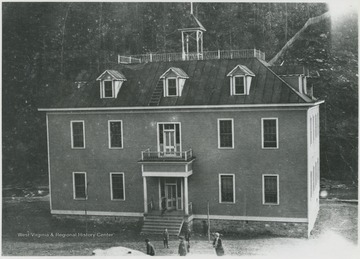 Students pictured outside the building. Subjects unidentified.  The school was established in 1909.